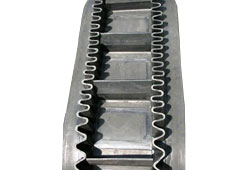 Correa transportadora de flanco flexible